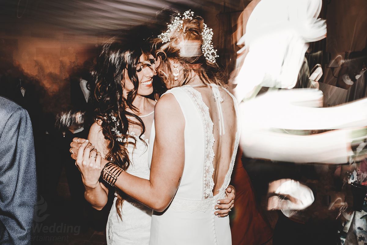Two brides sharing an intimate dance at wedding reception