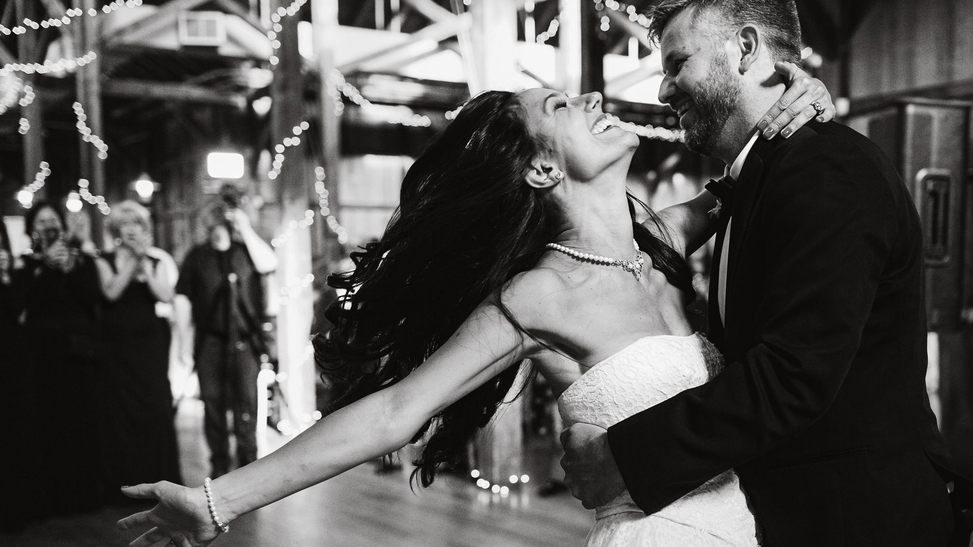 Bride and groom laughing together during first dance at Melbourne wedding